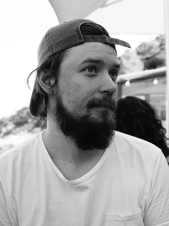 Jonatan Jansson, software engineer, in a backwards cap looking towards ten o'clock